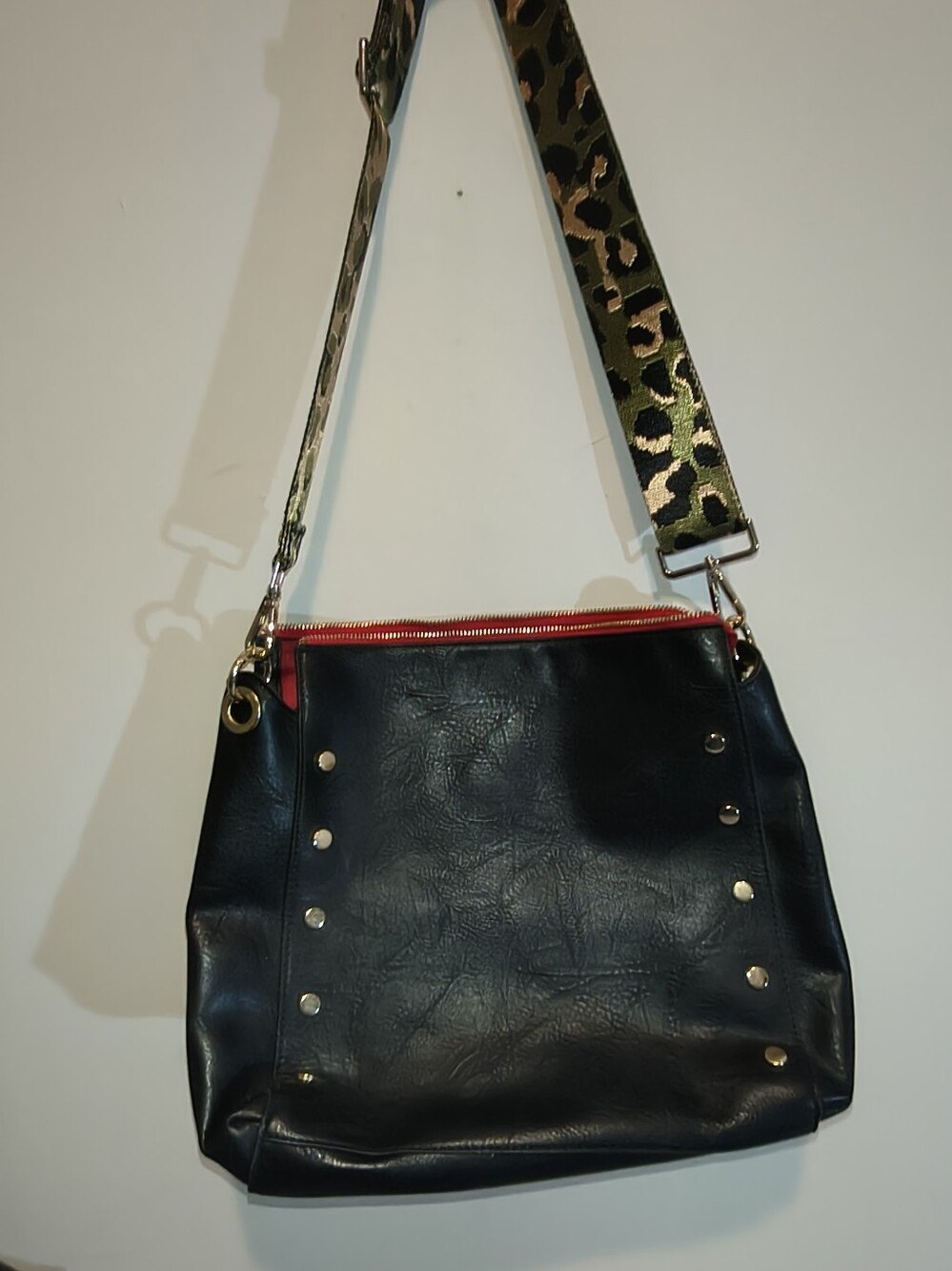 Social Threads Black Shoulder Bag with Leopard Accent Strap and Red Zip Detail